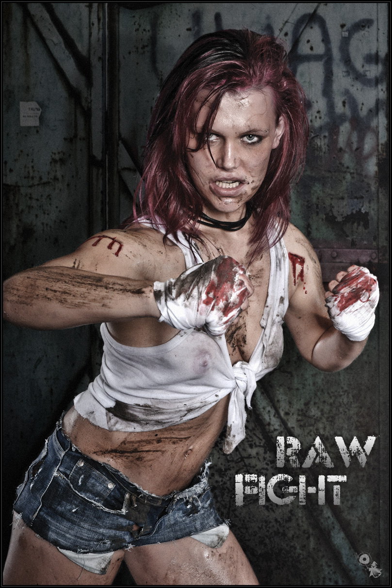 RAW Fight - Erotic Girlfight Portrait with a crazy tough girl in fighter pose covered in dirt and blood wearing tight jeans hotpants and a half transparent wet tank top showing a lot of her tits.  - © by Magistus