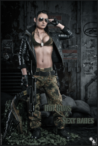 Hot Guns & Sexy Babes - Super hot and sexy model is showing a lot of cleavage and big boobs while posing as a erotic soldier babe with a machine gun in her hands wearing camouflage pants and a leather jacket. - © by Magistus