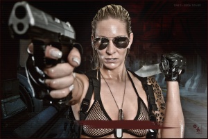 Dangerous Surveilance - Erotic Fightergirl Composing with fantastic sexy model wearing sunglasses and a hot and fully transparent bikini top showing her nipple piercings pointing with a gun into the camera. - © by Magistus