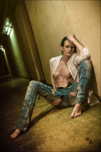 Raw Jeans - Erotic Jeans Nude Photoshoot with fantastic model sitting topless in a dark floor wearing cut blue jeans. - © by Magistus