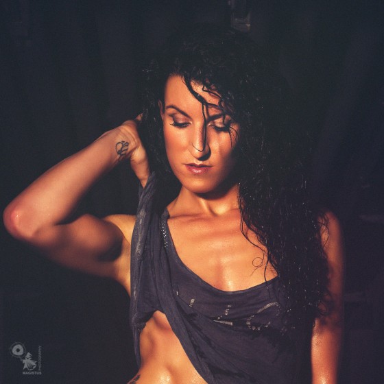Wet, Dark & Sexy - super hot fitness model is posing sexy in a dark place showing her fantastic sixpack - © by Magistus