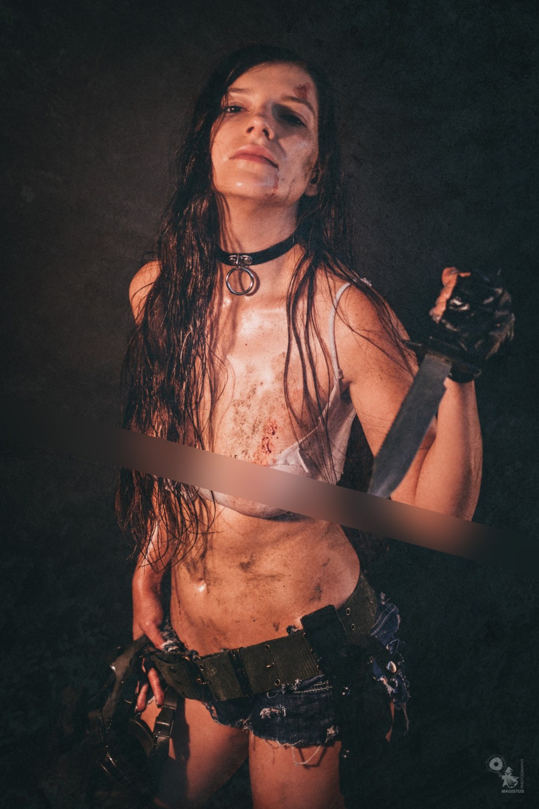 Dirty fightergirl posing topless in dirt
